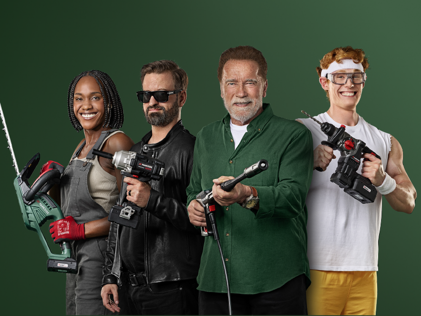 Four people, including Arnold Schwarzenegger, holding Parkside power tools.