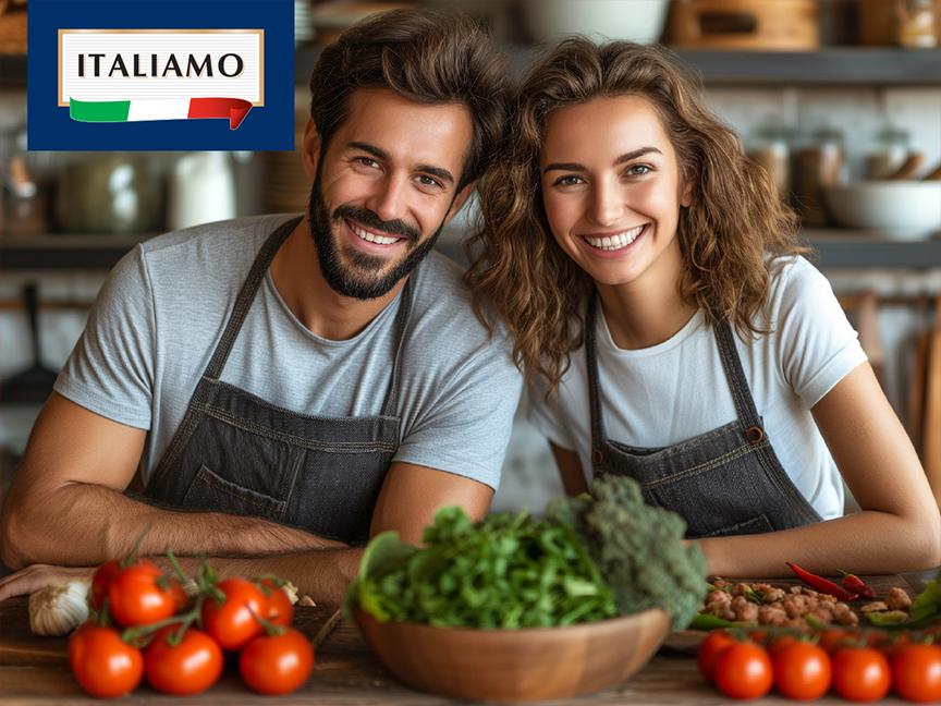 A smiling couple in aprons cooking with fresh vegetables and an 'ITALIAMO' logo.