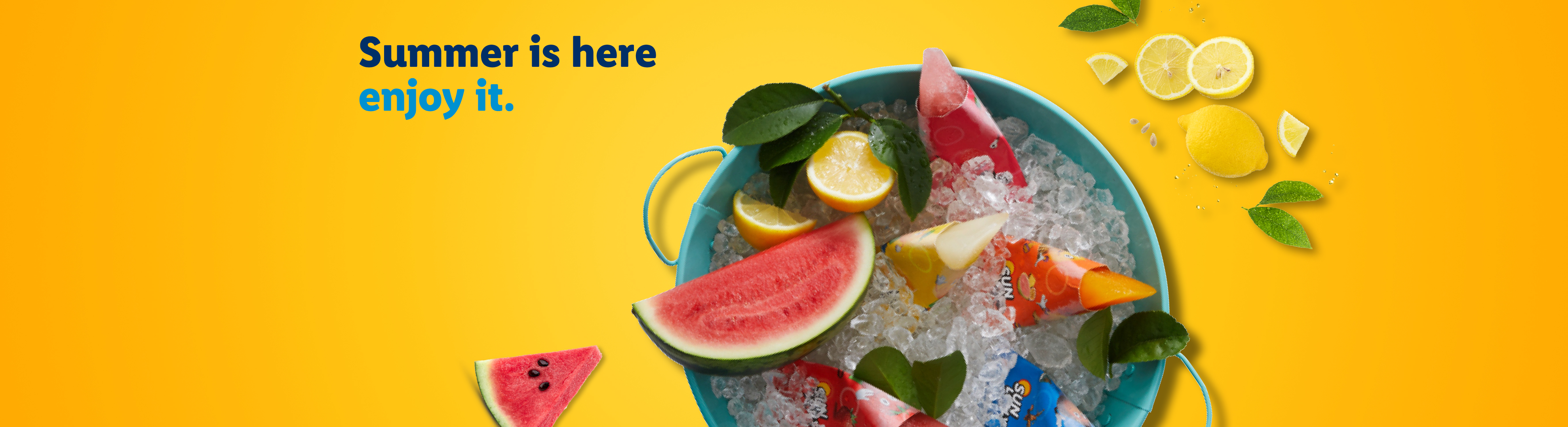 Summer is here, enjoy it. Ice pops, watermelon, and lemons in a bucket of ice.