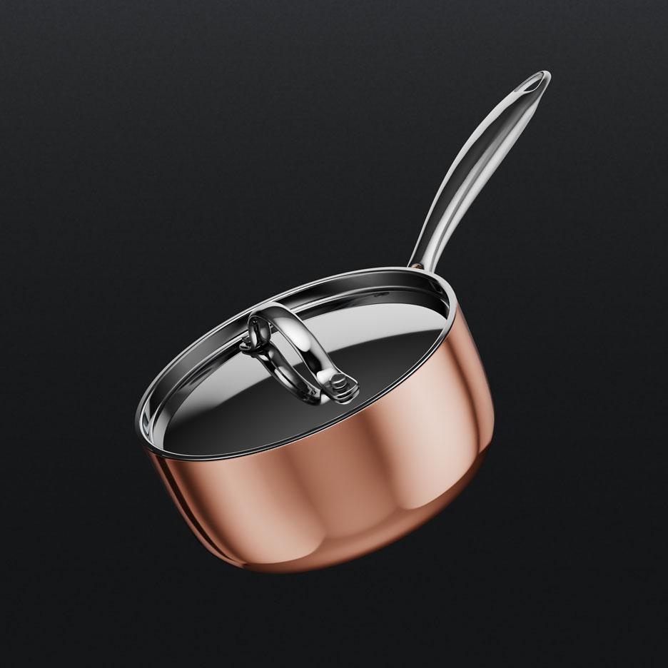 Copper-colored saucepan with lid and metal handle.
