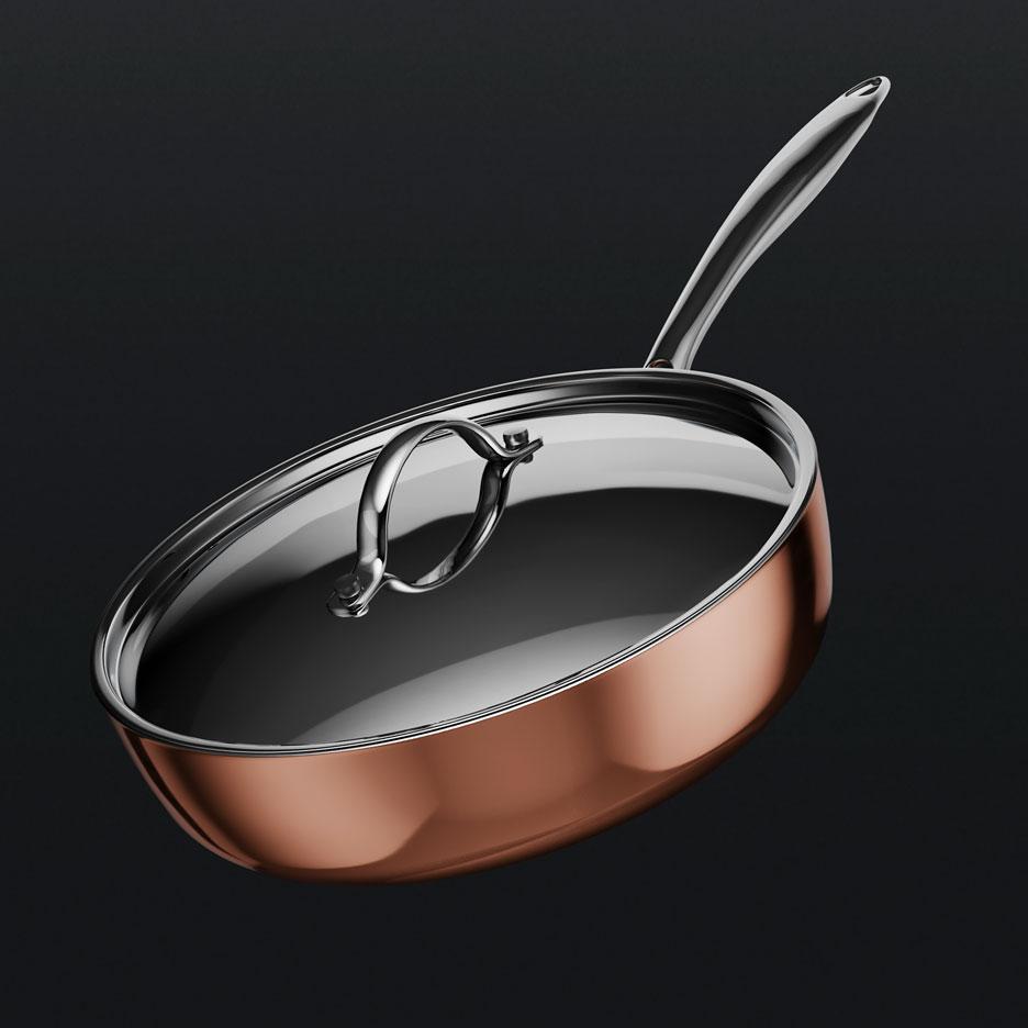 Copper-colored frying pan with a stainless steel handle and a glass lid.