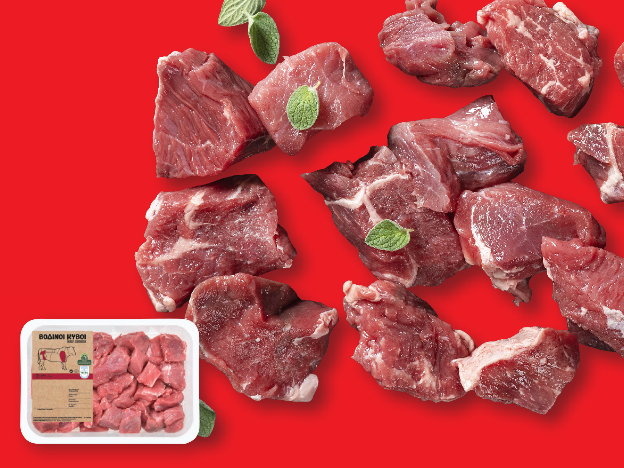 Beef cubes on a red background.