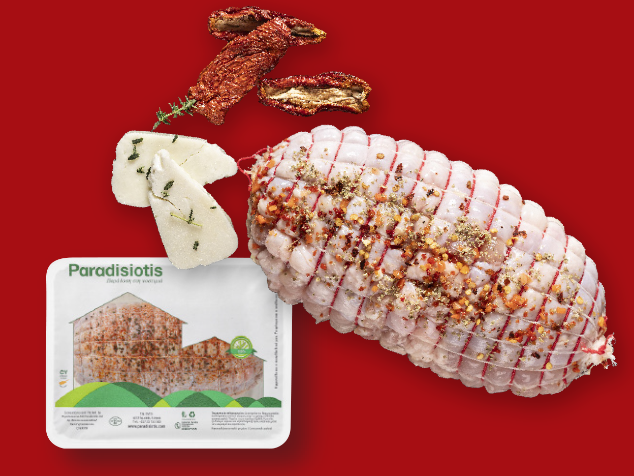 Raw stuffed chicken roll, cheese, and dried tomatoes on a red background.
