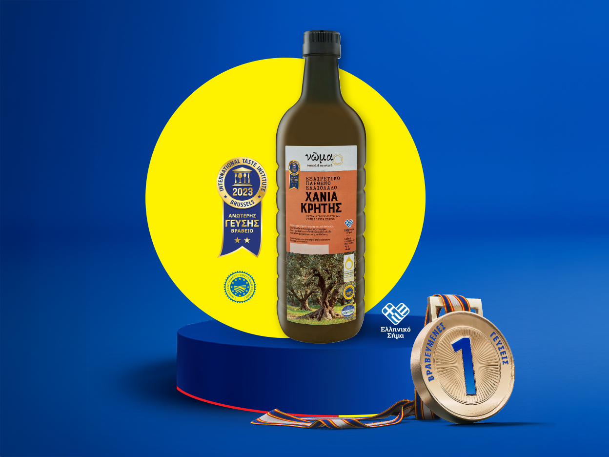 A bottle of olive oil with awards, including a gold medal and a taste institute ribbon.