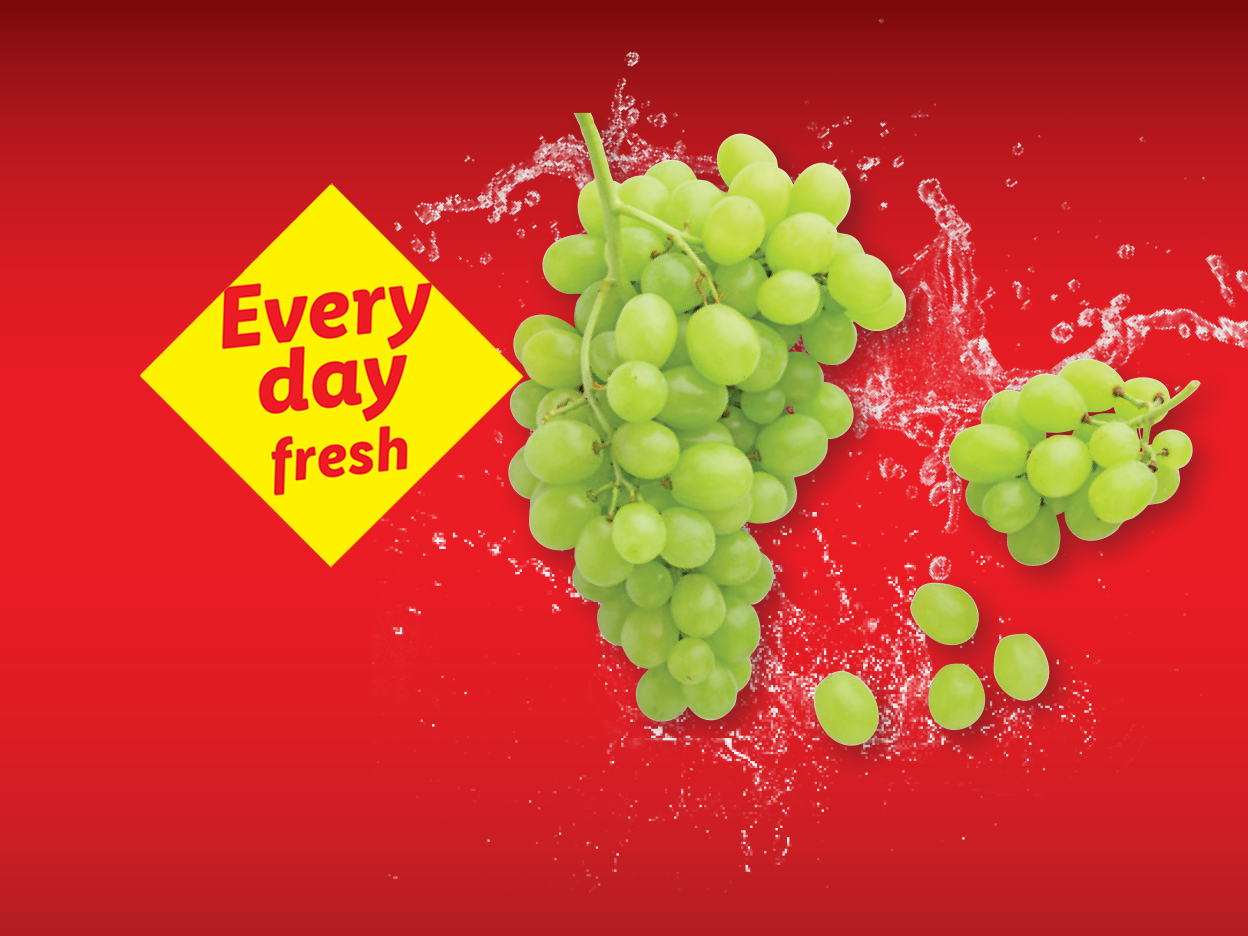 Green grapes with water splashes on a red background, with text 'Every day fresh'.