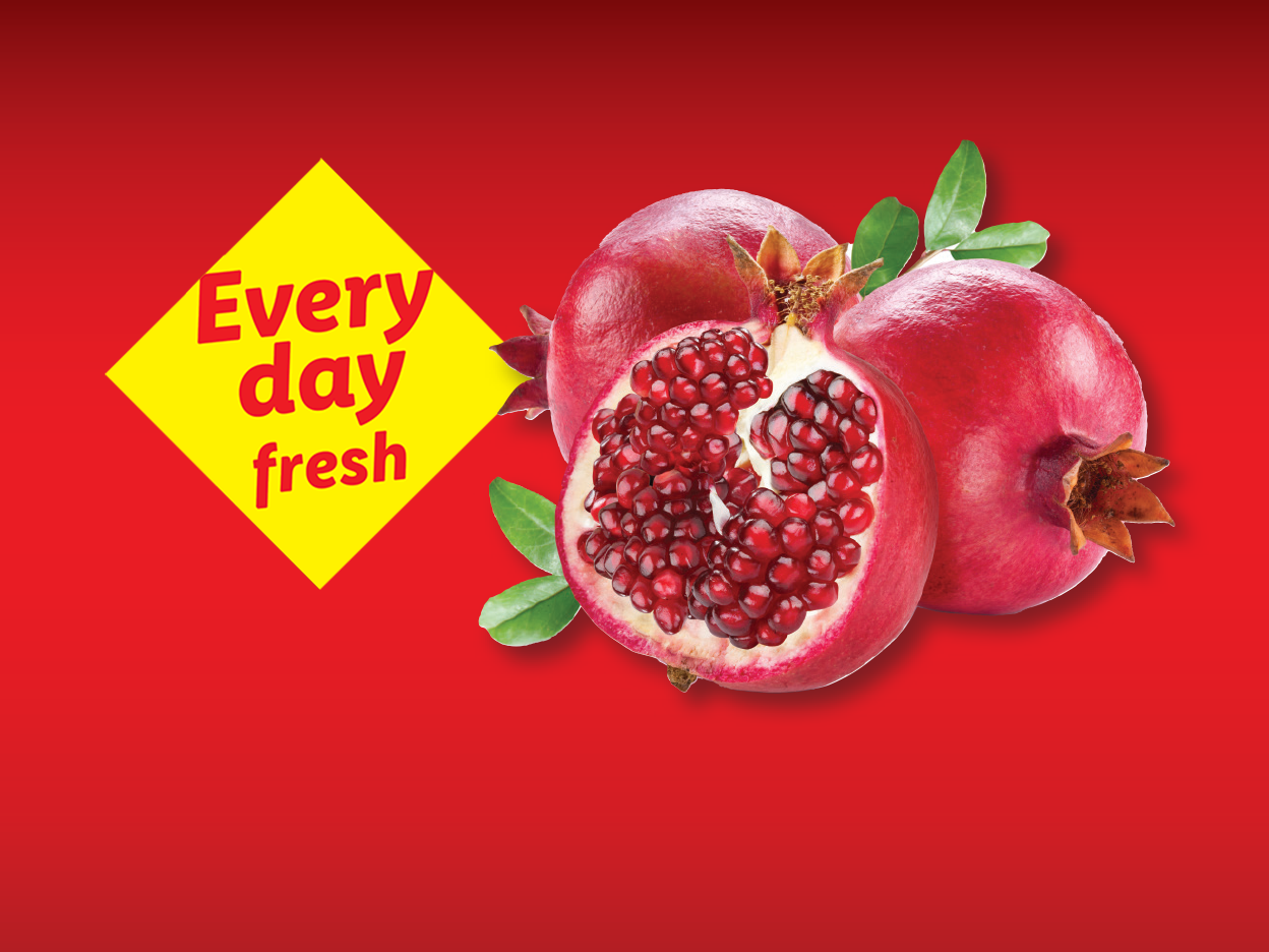 Pomegranates with a yellow diamond graphic stating 'Every day fresh' on a red background.