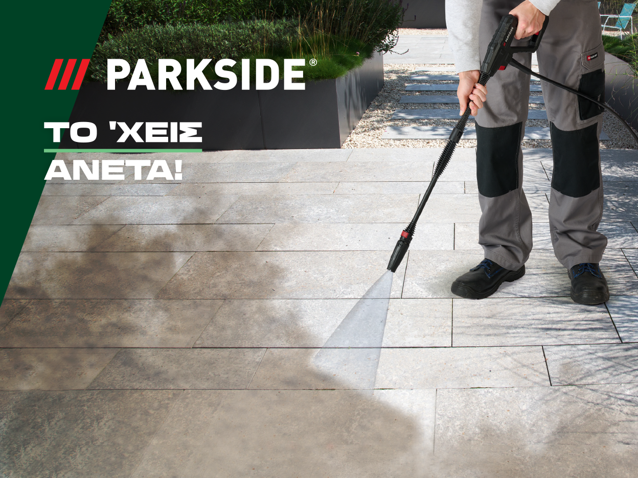 A person uses a Parkside pressure washer to clean a patio.