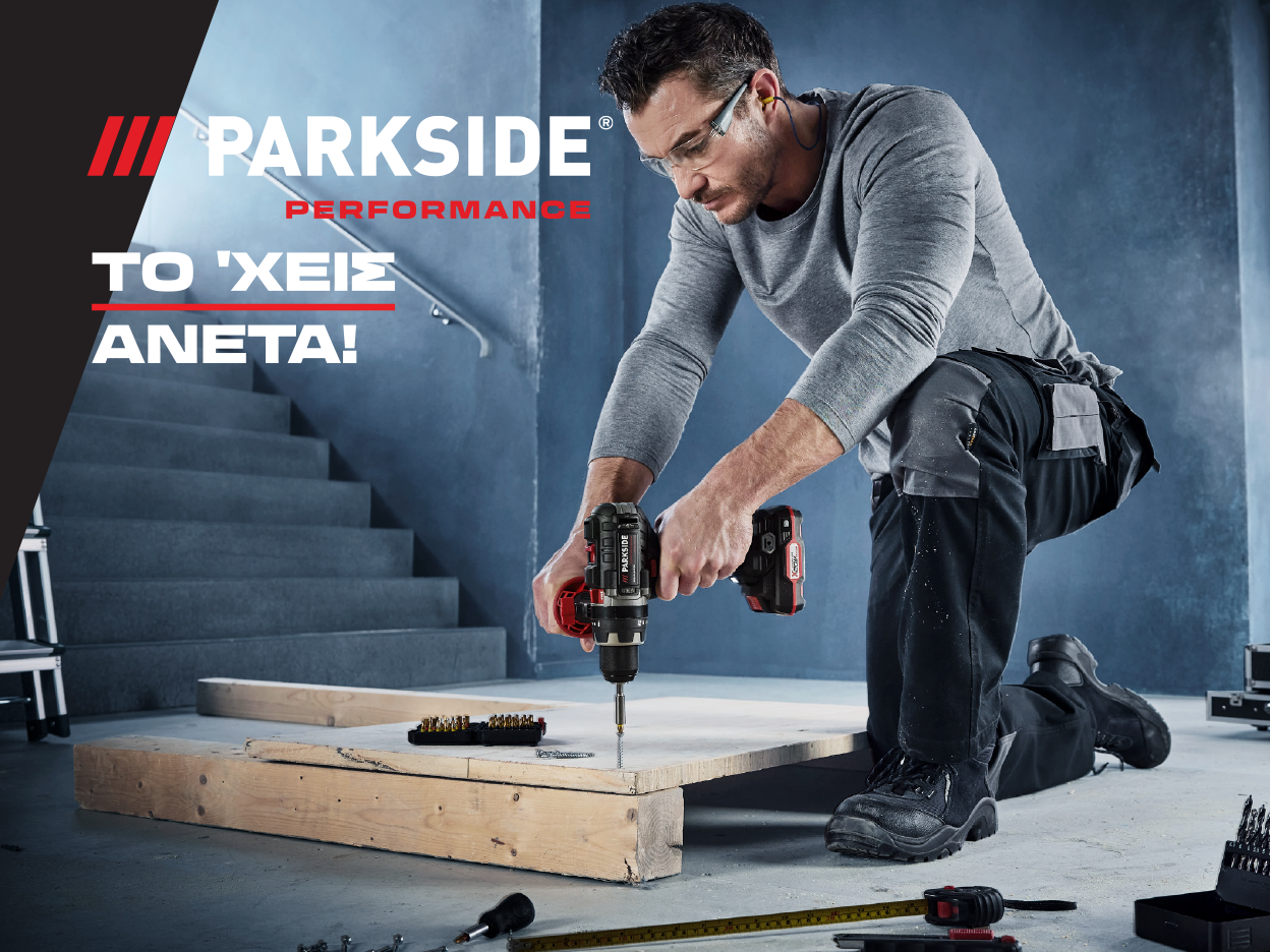 A man uses a Parkside Performance drill to work on wood.