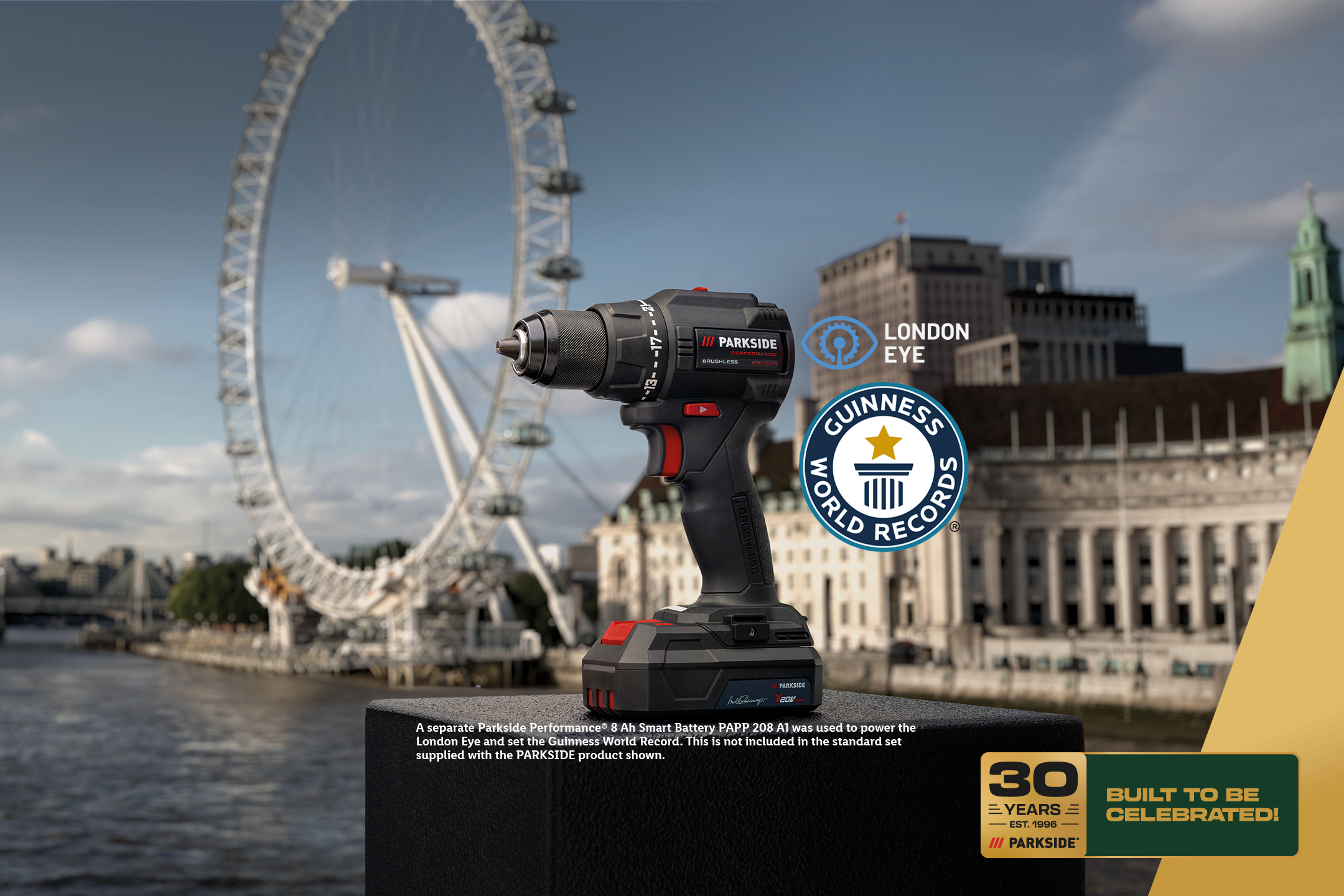 A power drill with a battery, set against the London Eye, celebrating 30 years and a world record.