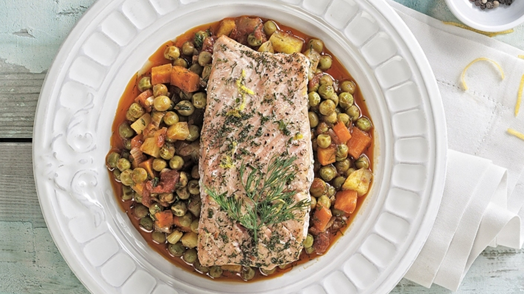 Baked salmon with peas and carrots.