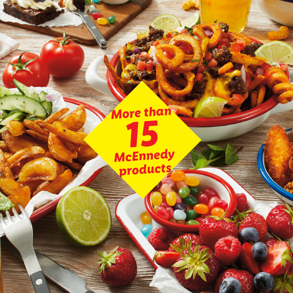 Table spread with various dishes: curly fries, potato wedges, fried chicken, fresh berries, and jelly beans. Text: 'More than 15 products'