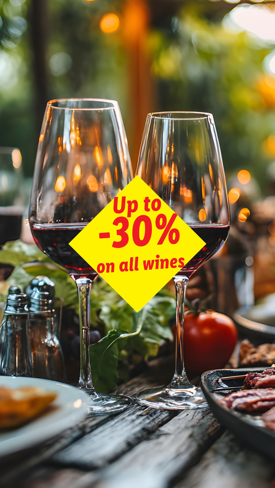 Two glasses of red wine on a table with food, advertising 'Up to -30% on all wines'.
