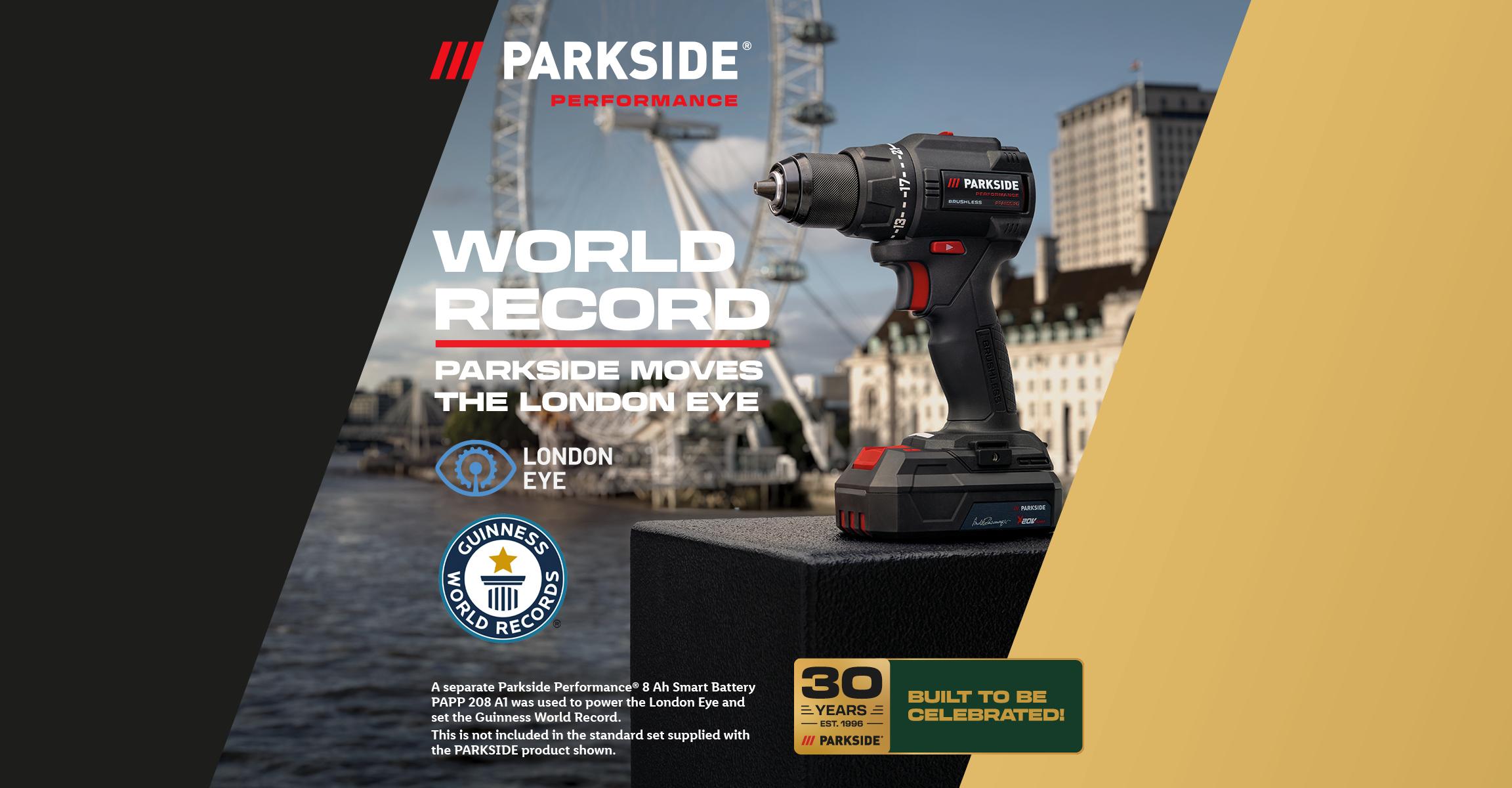 A power drill with a Guinness World Records logo, celebrating 30 years, against a London Eye backdrop.