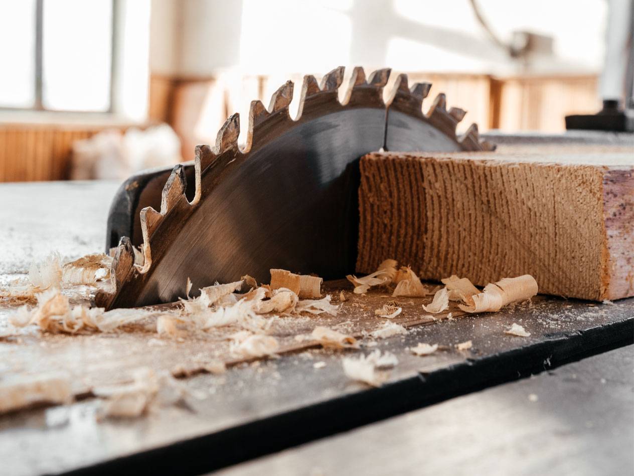 Wood pieces and a circular saw in a workshop.