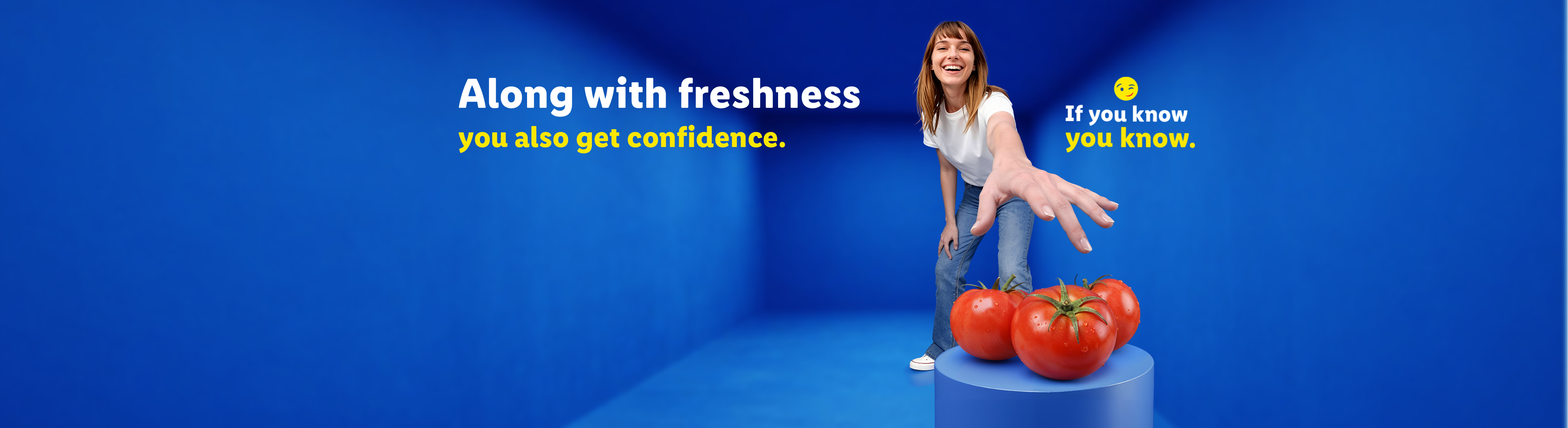 Smiling woman reaching for fresh tomatoes on a blue background with text about freshness and confidence.