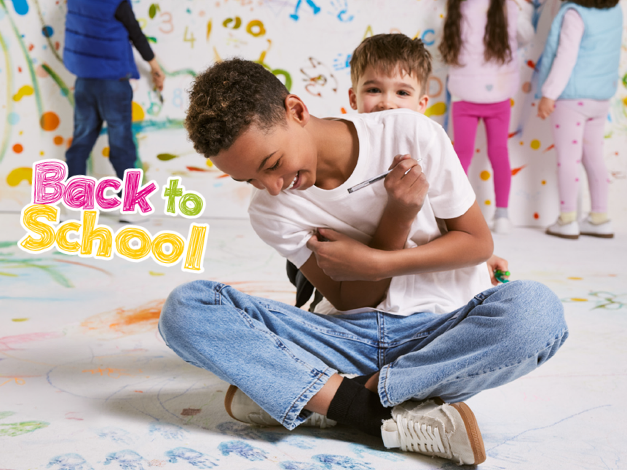 Children drawing on walls and floor, with 'Back to School' text overlay.