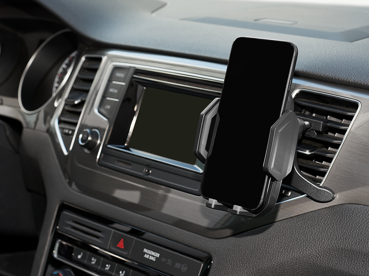 A black car phone mount holding a smartphone in a vehicle's dashboard.