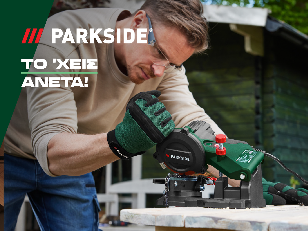 A man in work gloves uses a Parkside electric chainsaw sharpener on a wooden table.