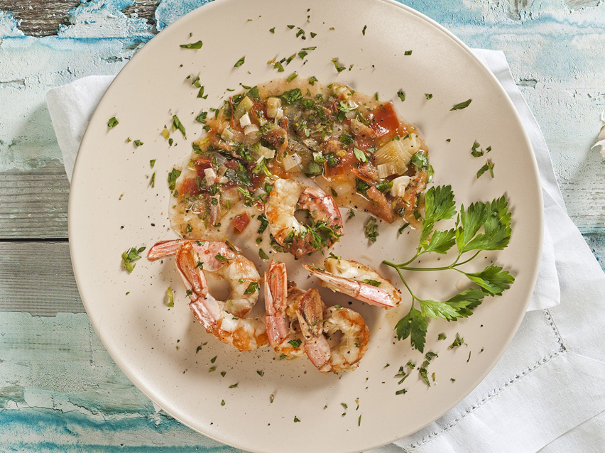 Shrimp in tomato and herb sauce.