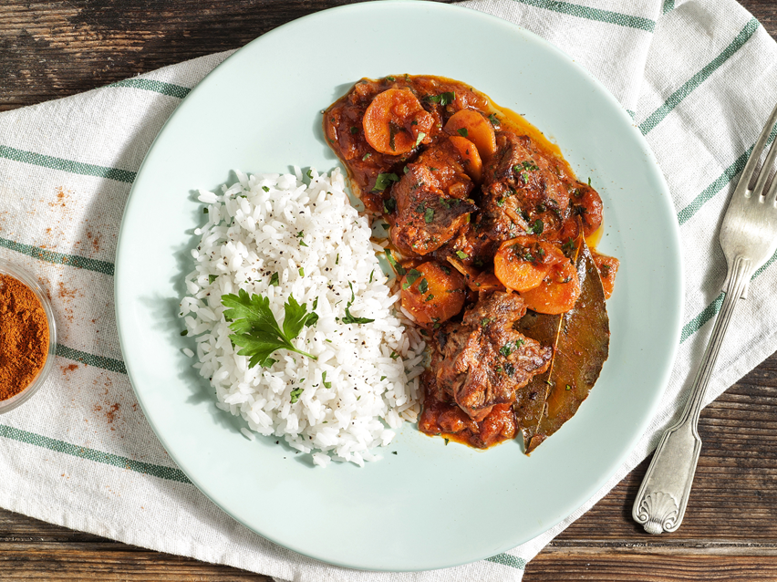 Beef stew served with white rice.