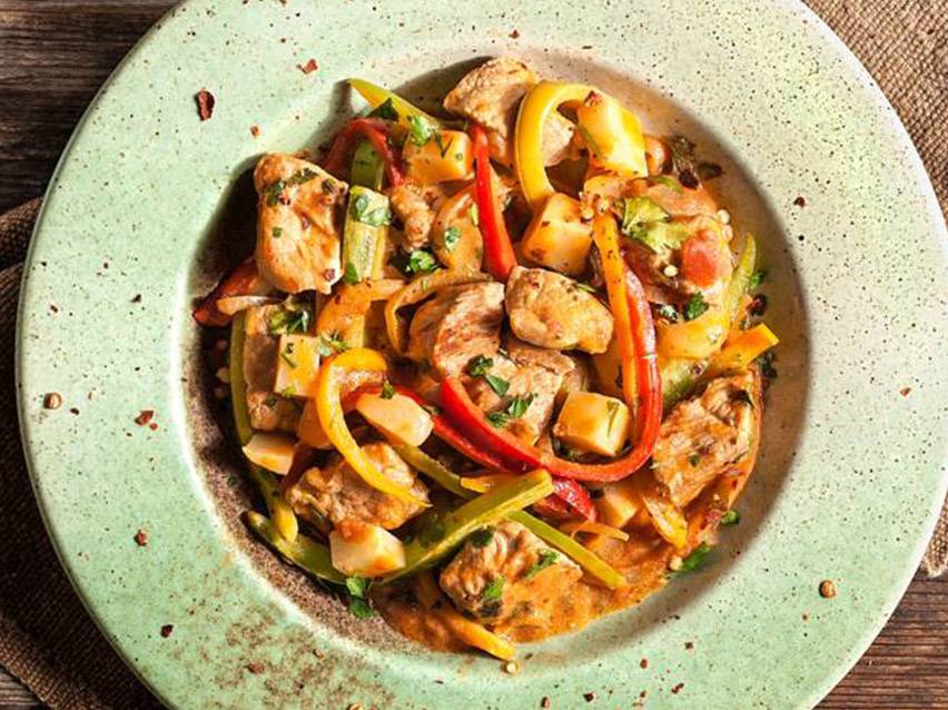 Meat dish with peppers and potatoes.