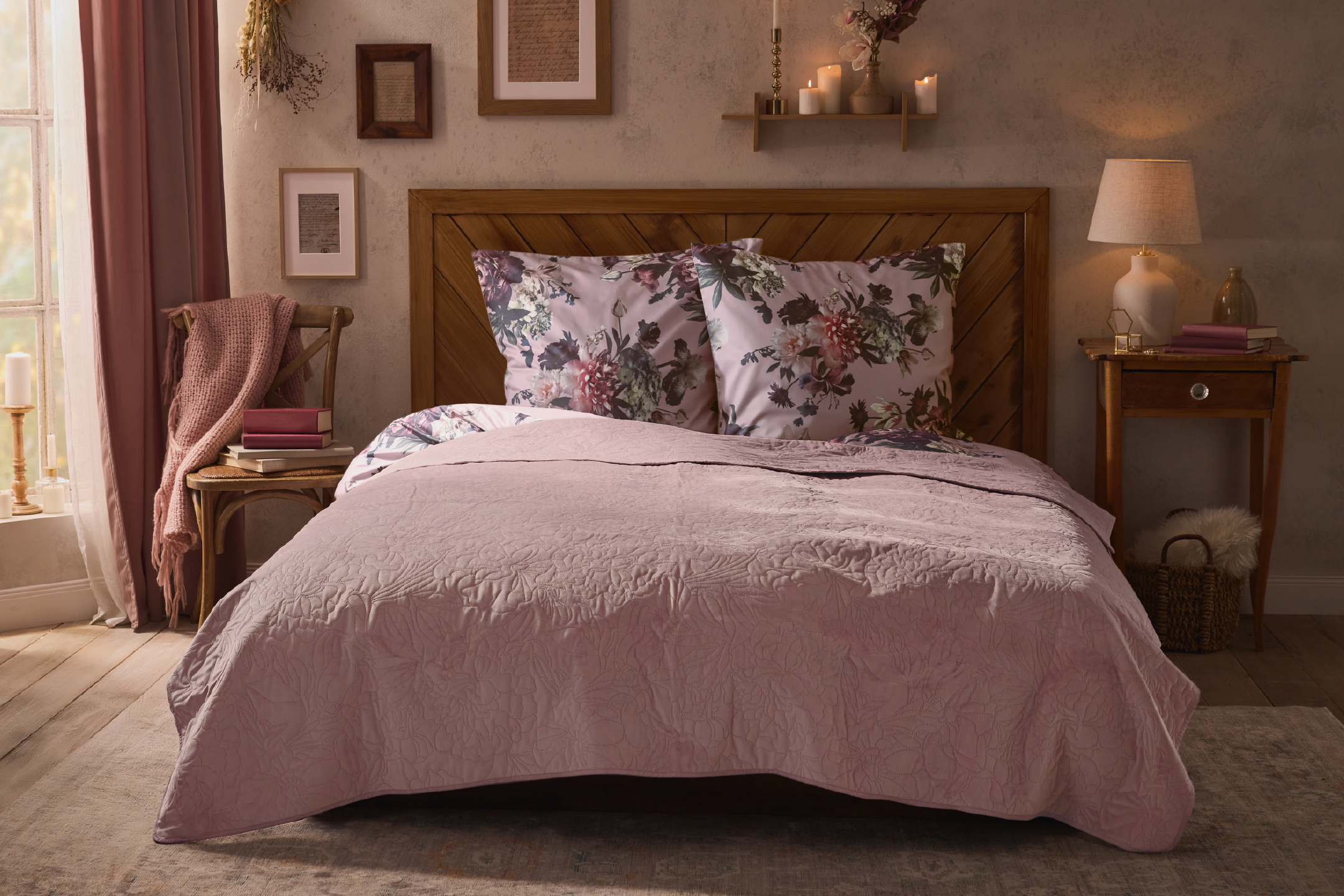 Bedroom with floral bedding, wooden headboard, and cozy lighting.