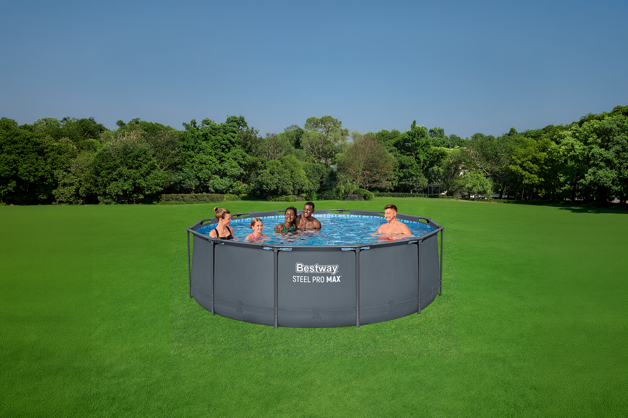 Family enjoying a round above-ground pool in a grassy field with trees in the background.