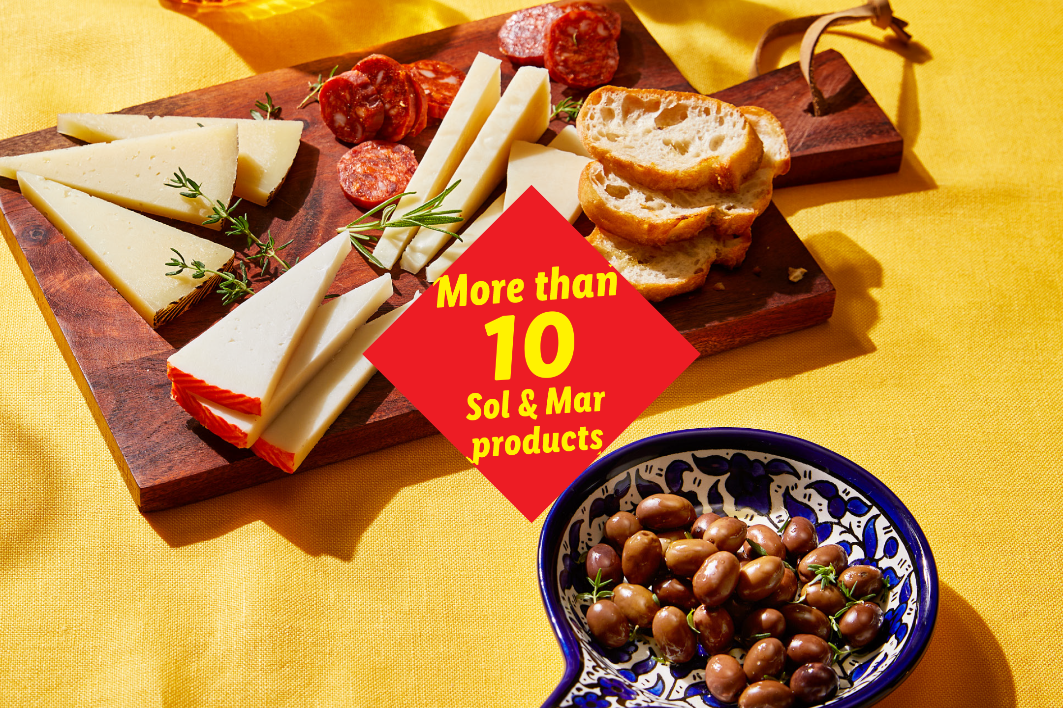 A tapas board with cheese, chorizo, bread, and olives, with text 'More than 10 products'.