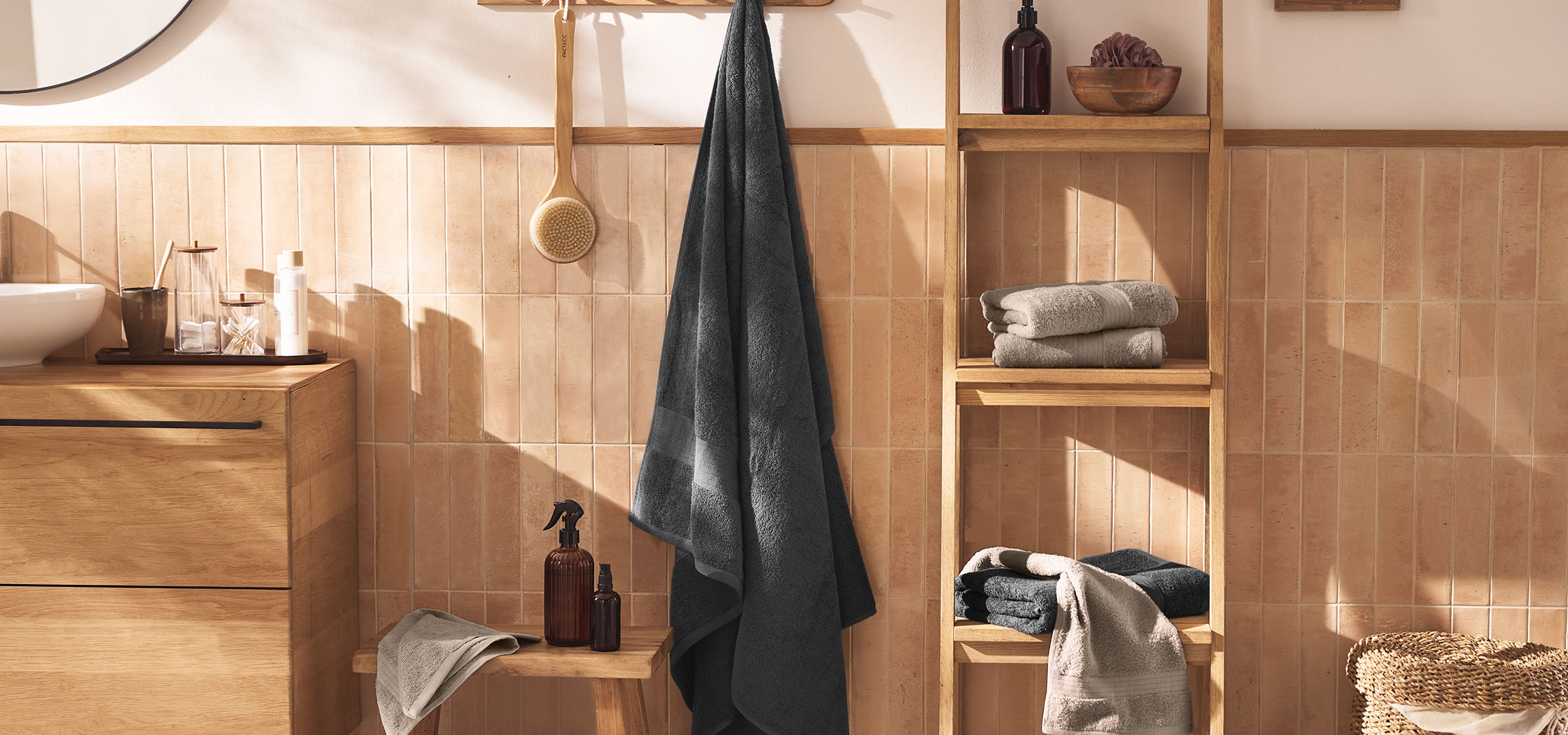 AI generated image: Modern bathroom with a sink, wooden vanity, towels, and accessories.